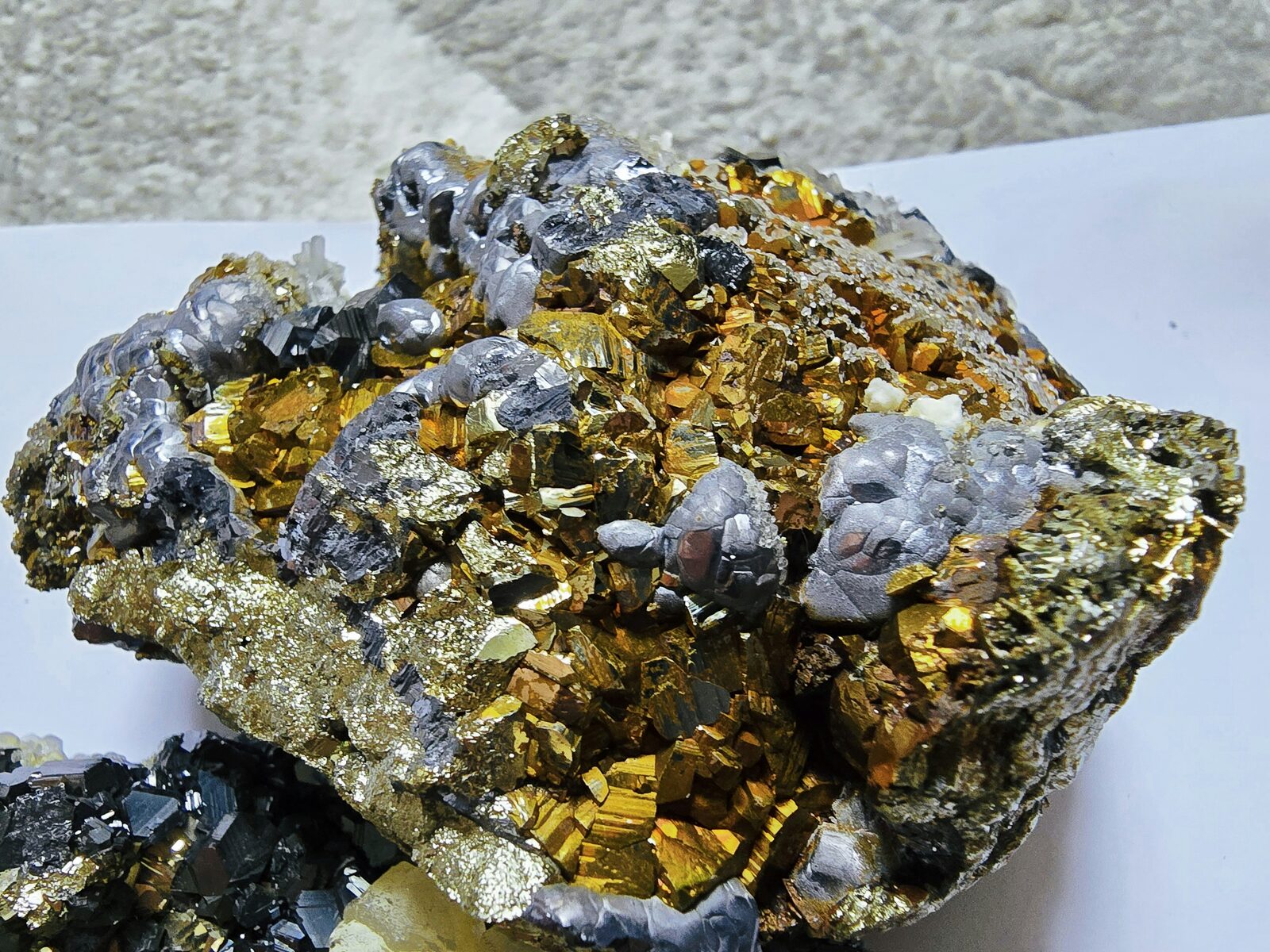 Chalcopyrite cluster with intergrown galena crystals on quartz matrix